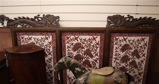 A large 19th century Javanese teak screen with Batik panels by Pamang 59cm